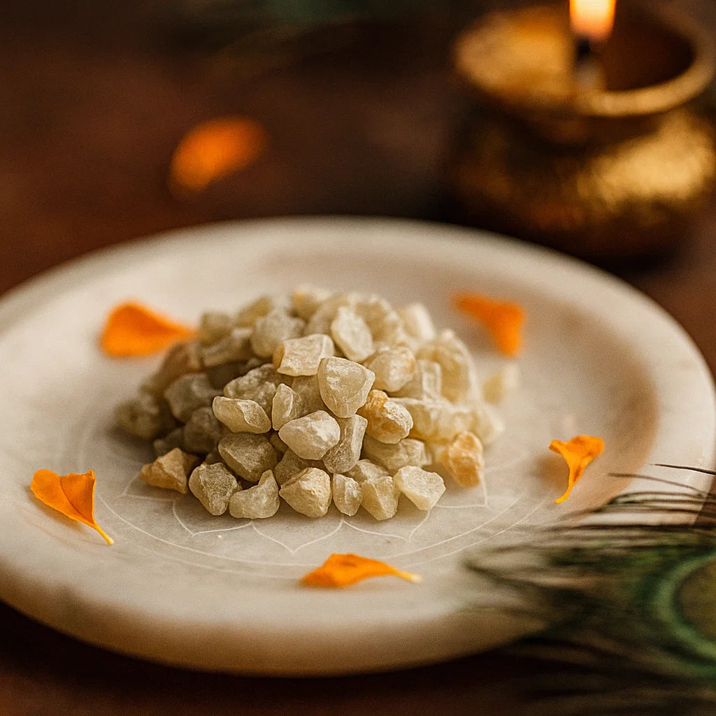 Angled close view of pale cat's eye gemstone chips on a decorated white plate