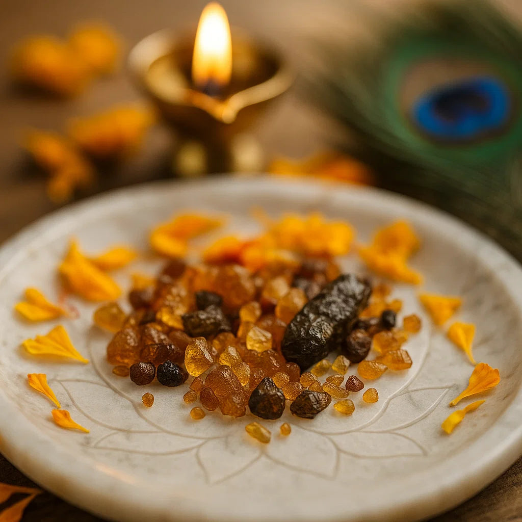 Small amber and brown hessonite gemstone chips arranged on a decorated white plate
