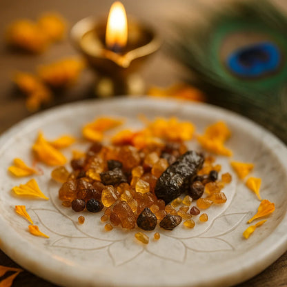 Small amber and brown hessonite gemstone chips arranged on a decorated white plate