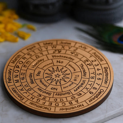 Angled brown astrological pendulum board on a light marble surface