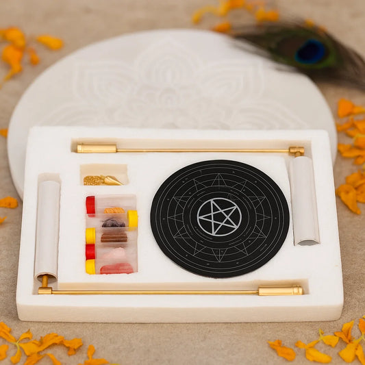Brass dowsing kit with L-rods, pendulum, circular board and sample vials in a white case