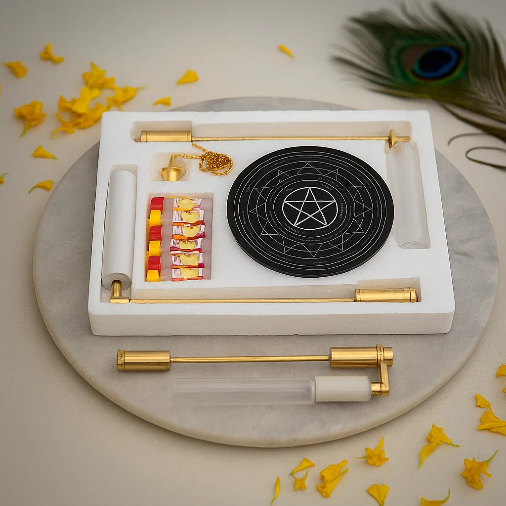 Complete brass dowsing tool kit arranged on a marble plate with sacred accents