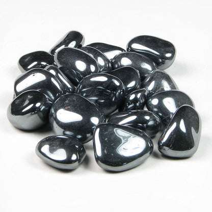 Polished hematite tumbled stones grouped on a clean white background