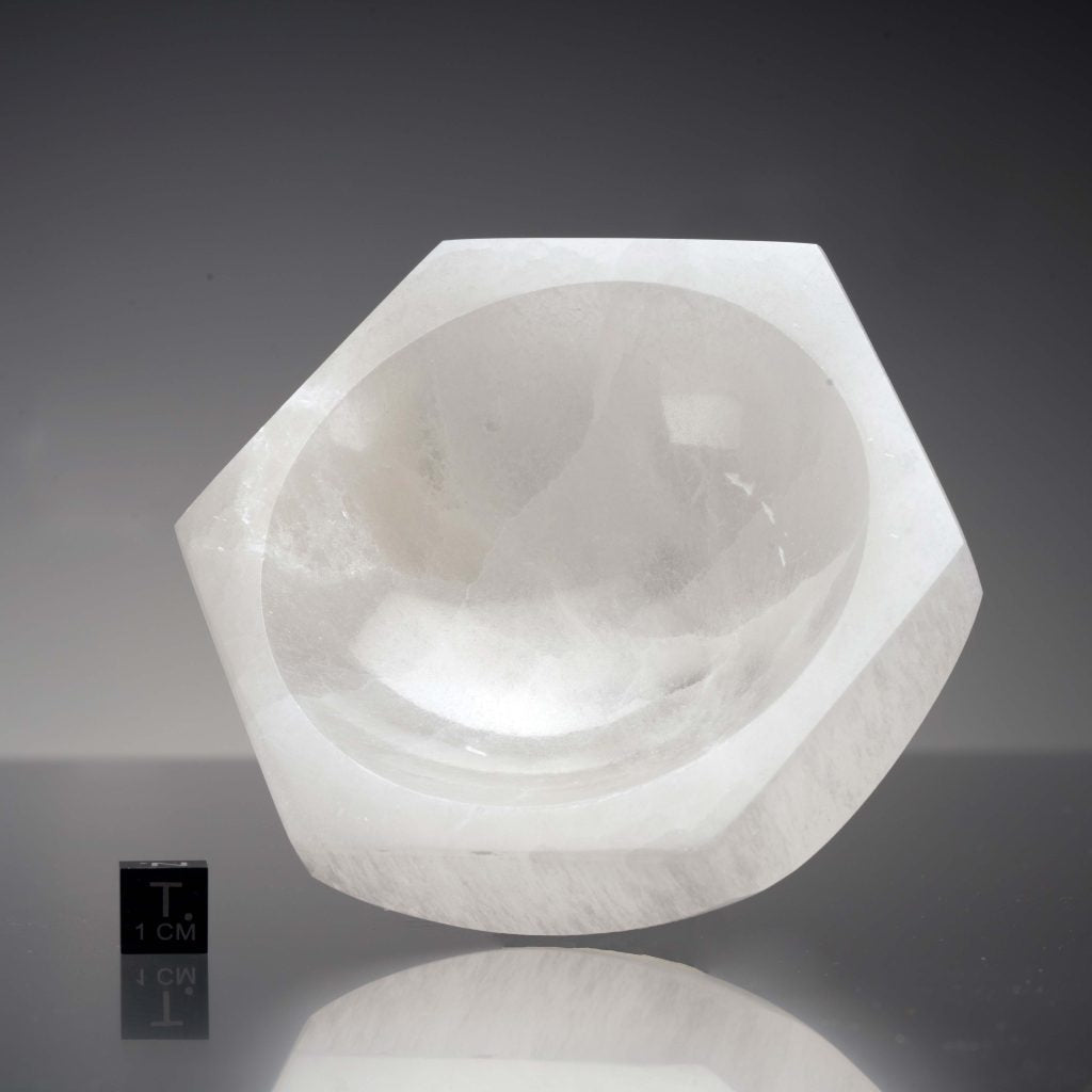 Hexagon selenite charging bowl arranged in a styled spiritual setting