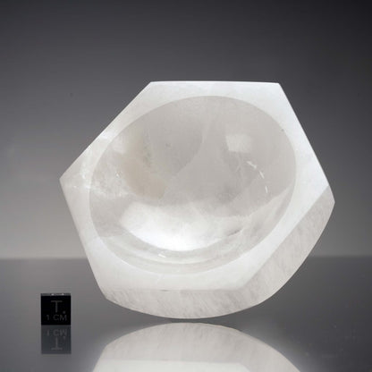 Hexagon selenite charging bowl arranged in a styled spiritual setting