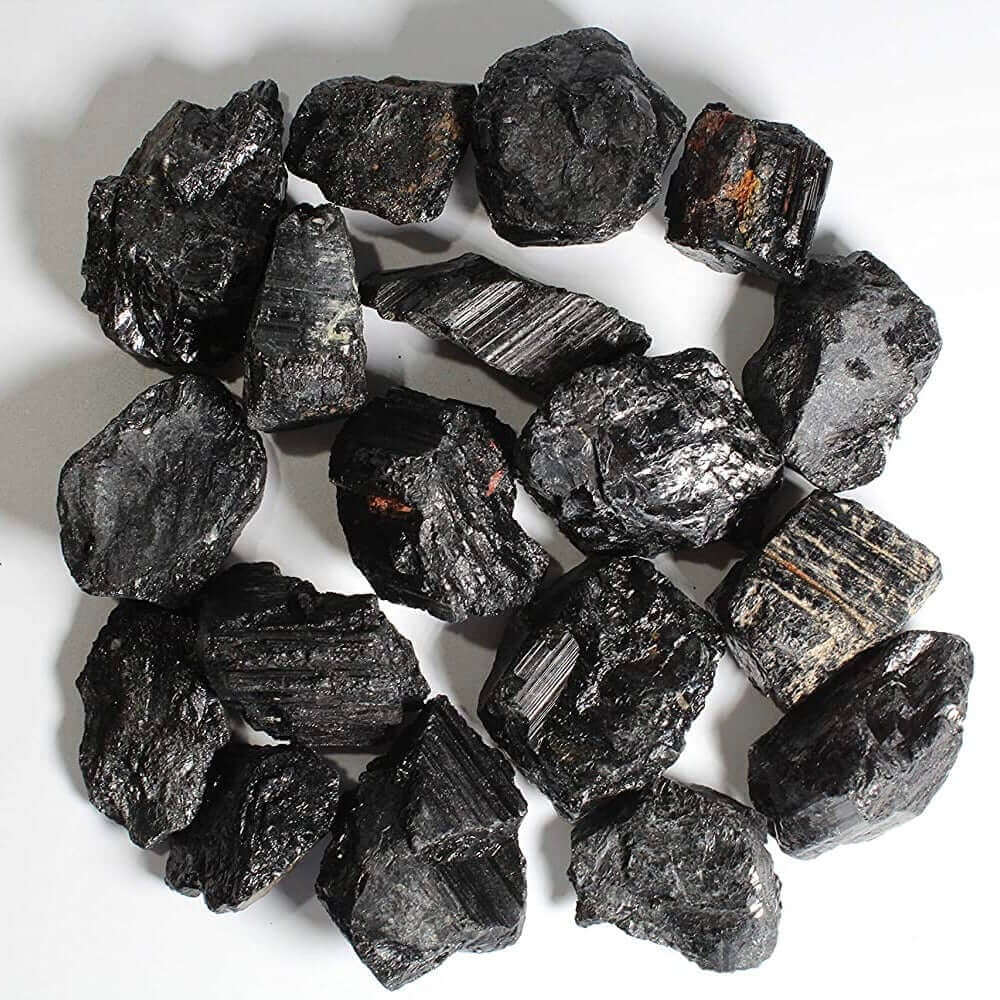 Ring of rough black tourmaline chunks isolated on a clean white background