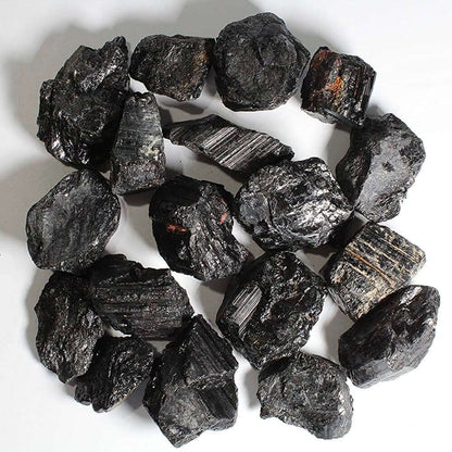 Ring of rough black tourmaline chunks isolated on a clean white background