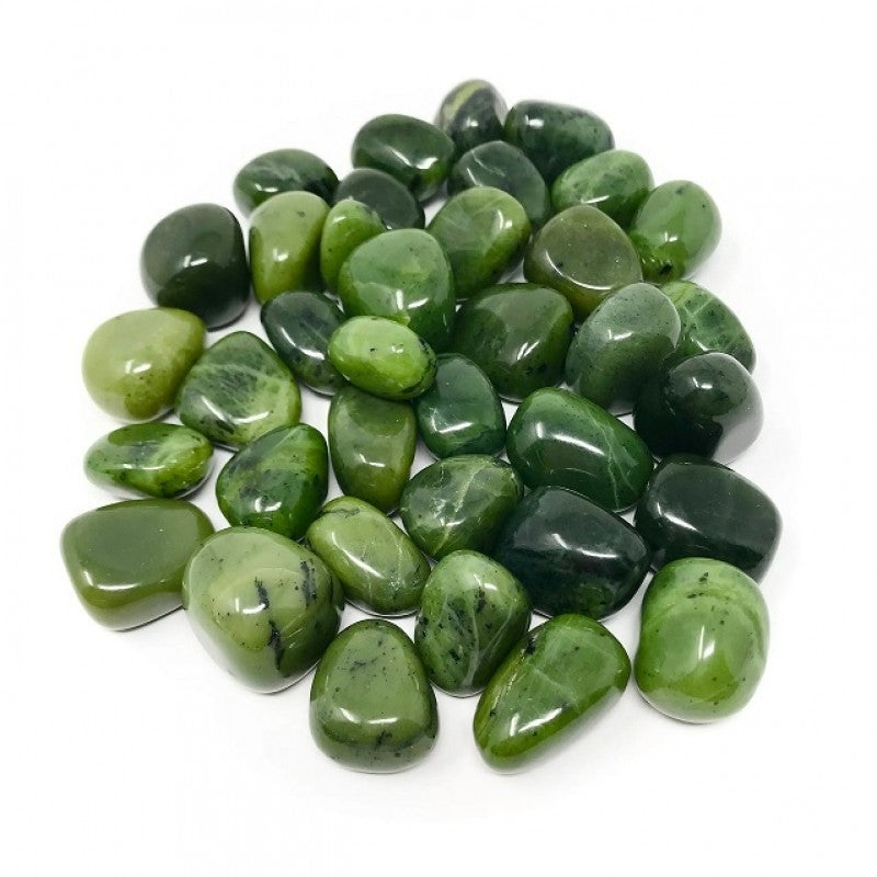 Close-up of green jade tumbled stones on a clean white background showing natural colour and texture