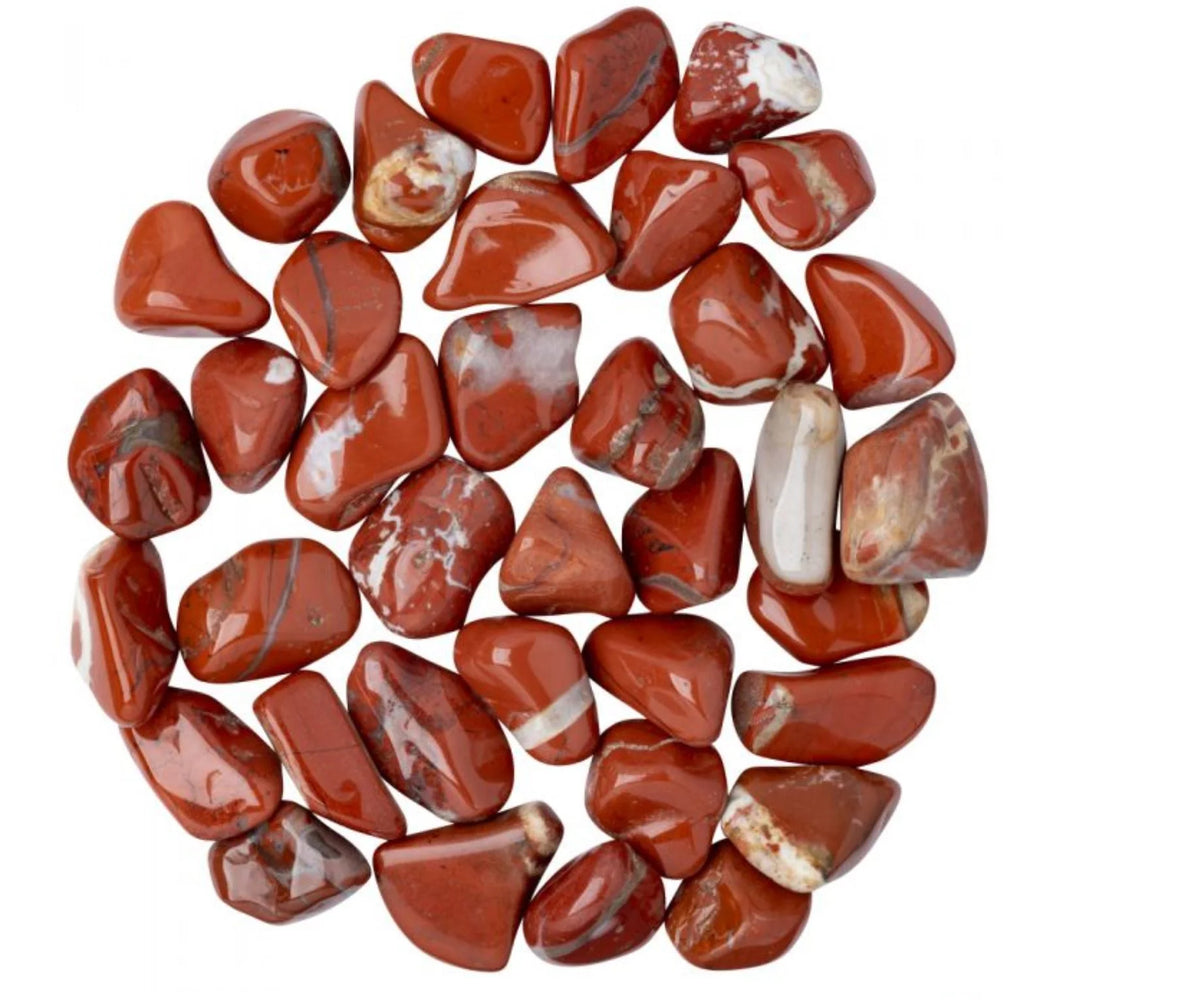 Red jasper stones arranged in a circular group on a white background