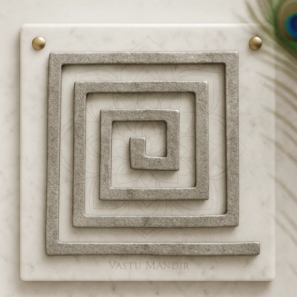 Lead Plain Vastu helix in a square spiral form displayed on a marble panel in a sacred setting