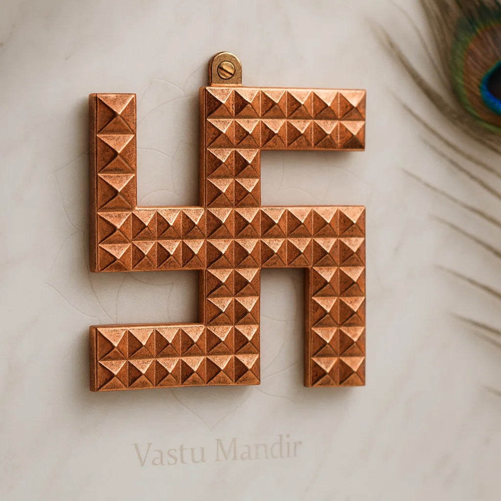 Copper swastik pyramid displayed in a styled sacred setting