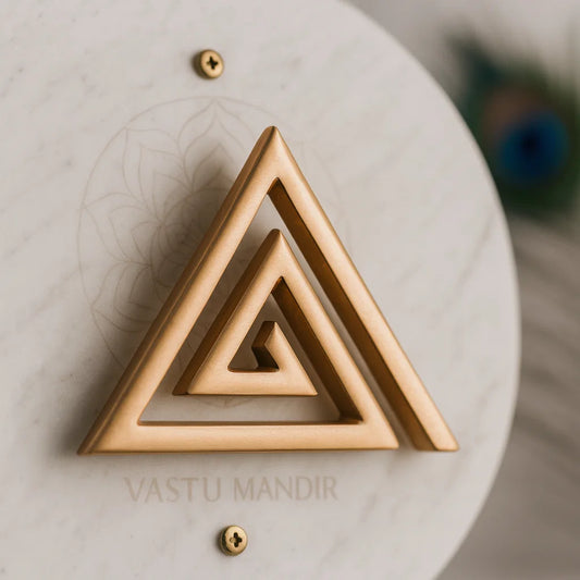 Copper Triangle Vastu helix displayed on a marble plate in a sacred setting