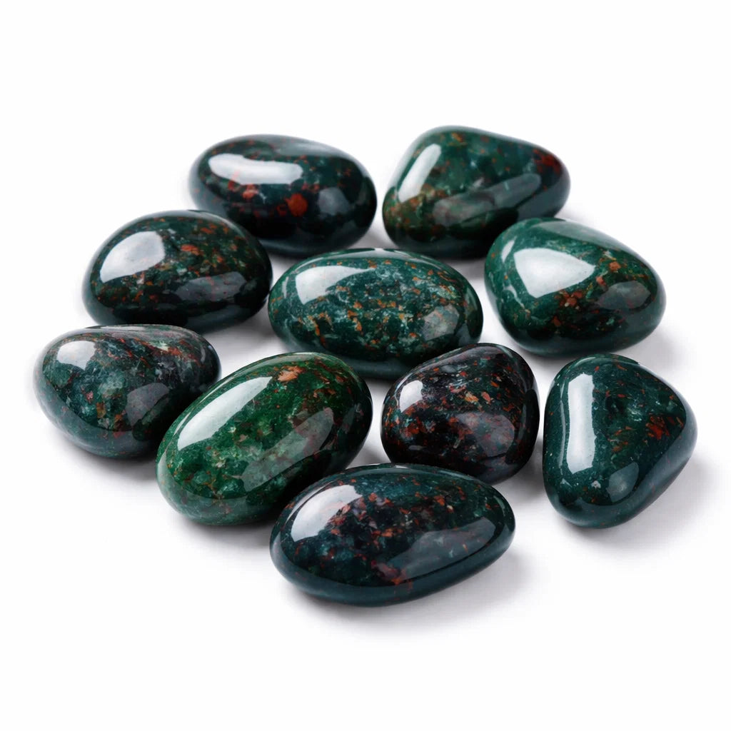 Natural bloodstone tumbled stones on a clean white background