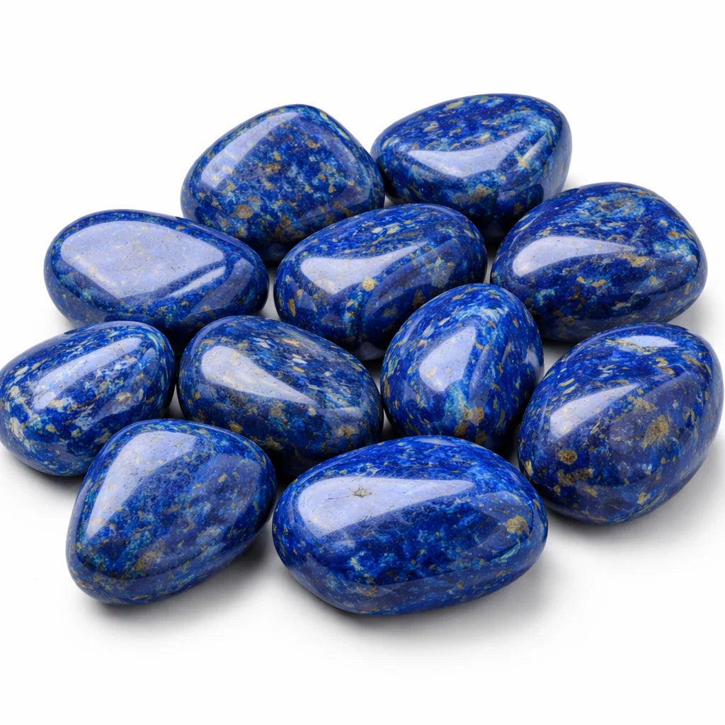 Close-up of lapis lazuli stones on a clean white background showing natural colour and texture