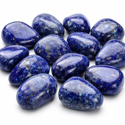 Rounded polished lapis lazuli stones grouped on a clean white background