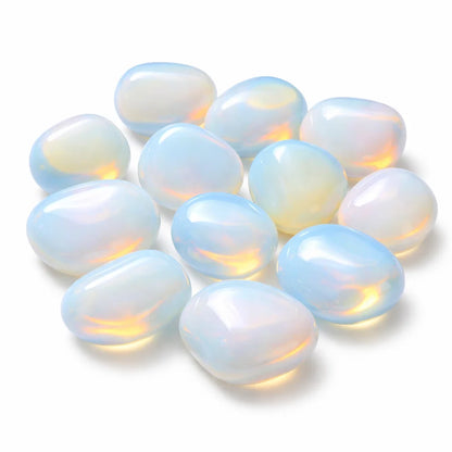 Close pile of milky opalite stones isolated on a clean white background