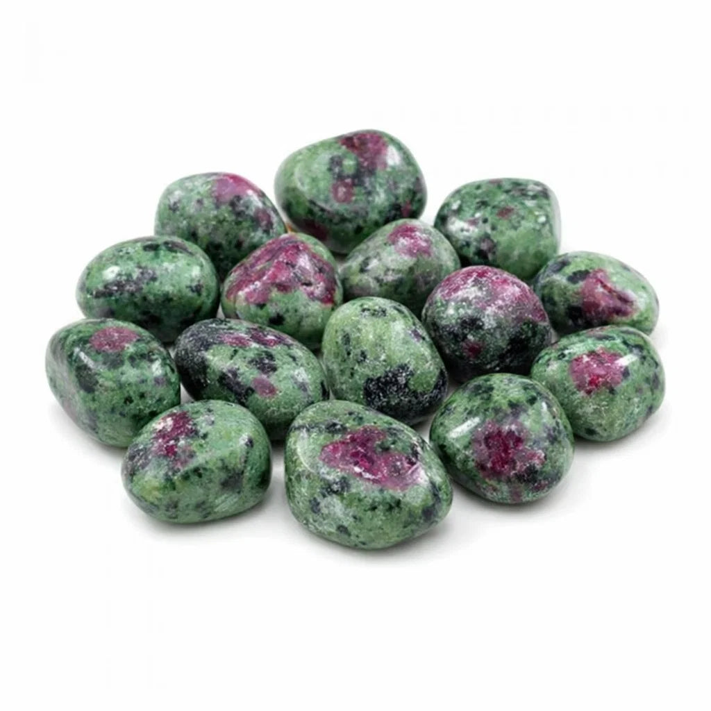 Ruby zoisite tumbled stones in a close product view on white