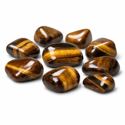 Close-up of tiger eye tumbled stones on a clean white background showing natural colour and texture