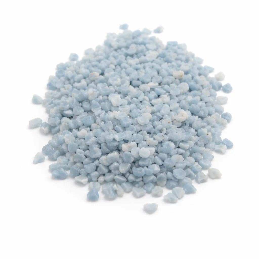 Pile of angelite crystal chips on a clean white background