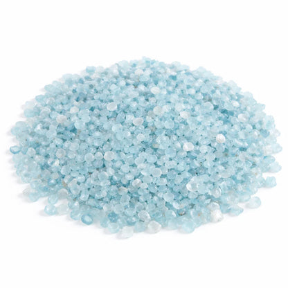 Pile of aquamarine crystal chips on a clean white background