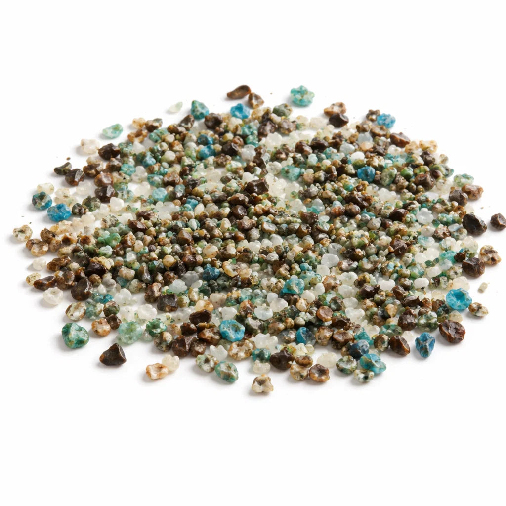 Pile of azurite crystal chips on a clean white background