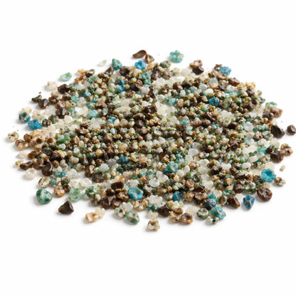 Pile of azurite crystal chips on a clean white background