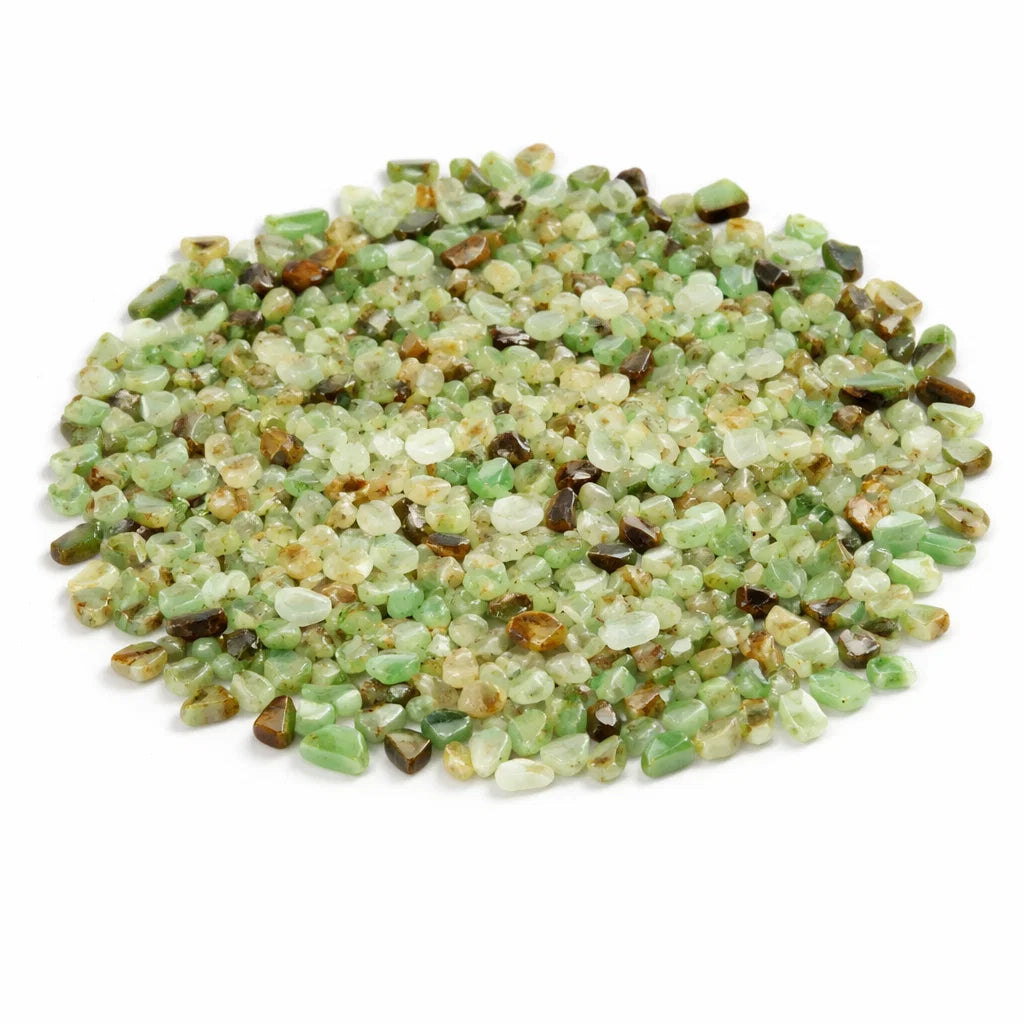 Close-up of chrysoprase crystal chips on a clean white background showing natural colour and texture