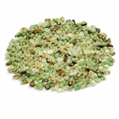 Close-up of chrysoprase crystal chips on a clean white background showing natural colour and texture