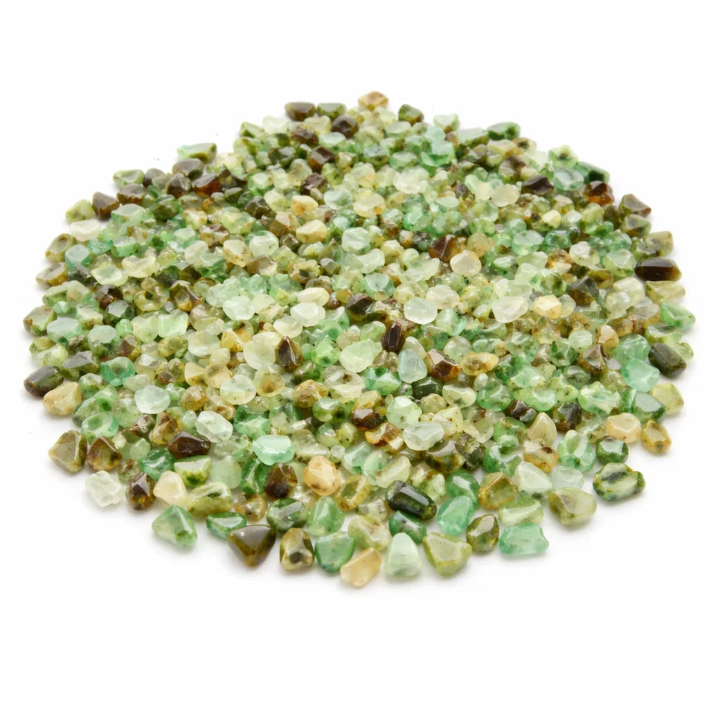 Pile of chrysoprase crystal chips on a clean white background