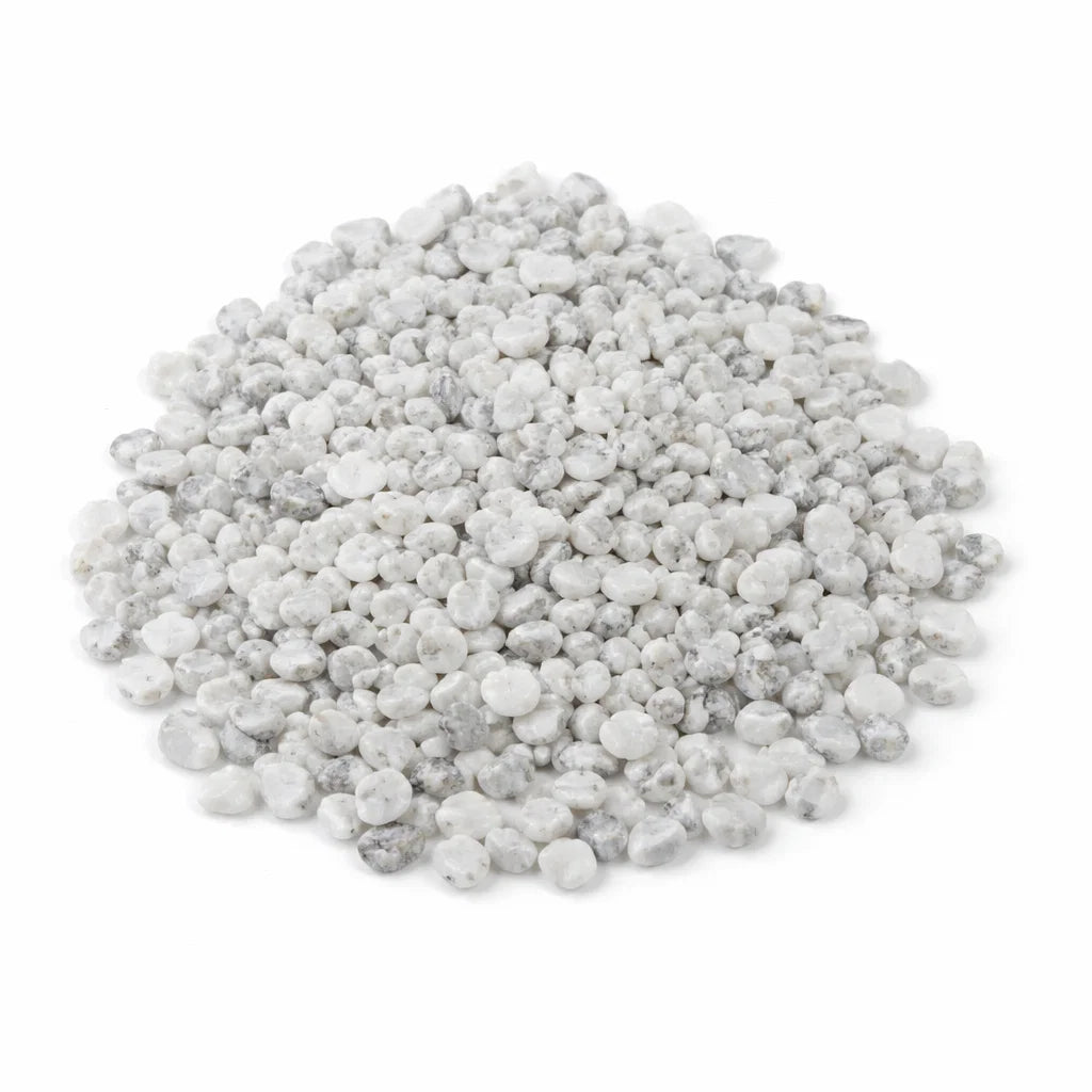 Pile of howlite crystal chips on a clean white background