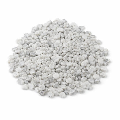 Pile of howlite crystal chips on a clean white background