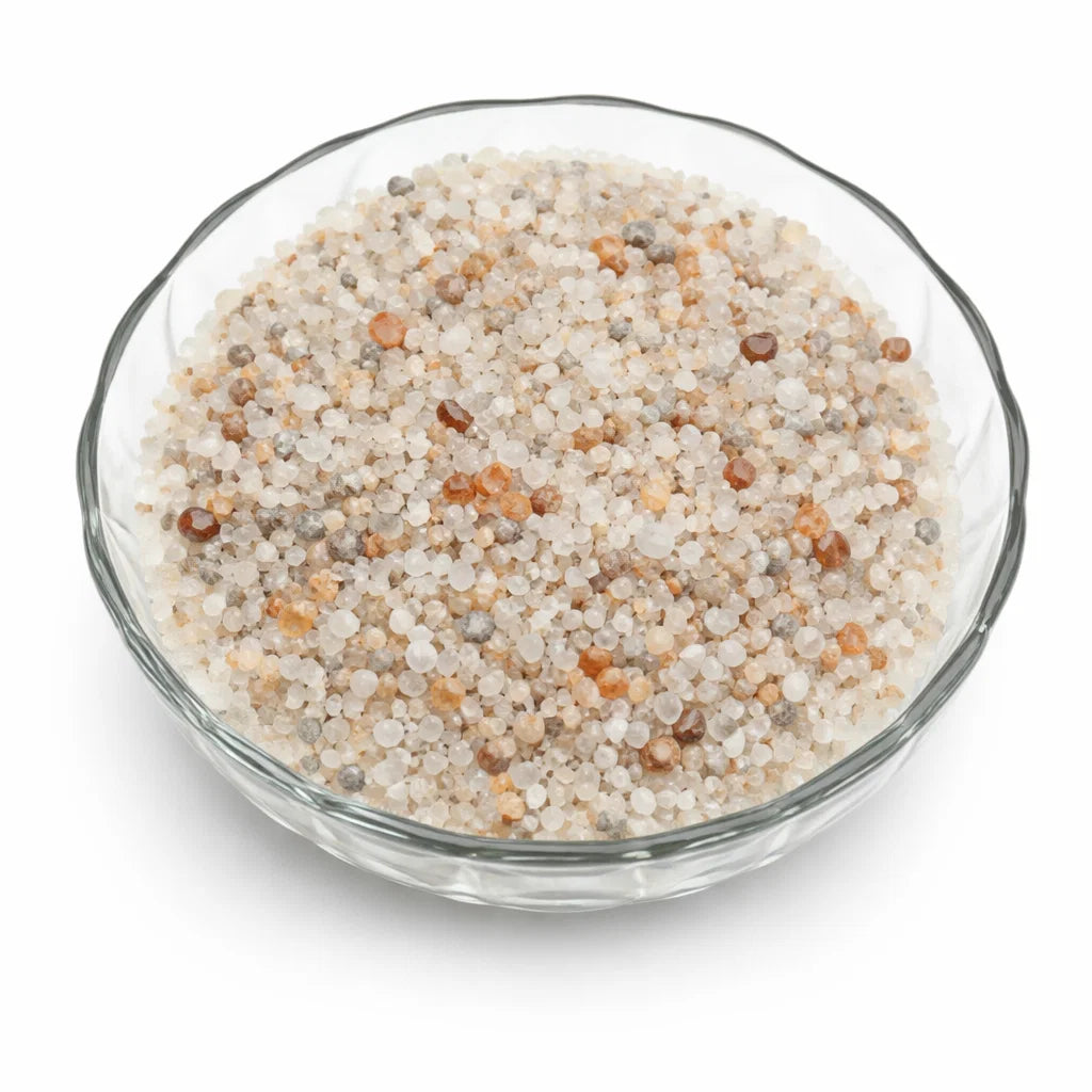 Close-up of moonstone crystal chips on a clean white background showing natural colour and texture
