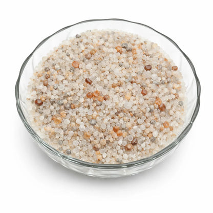 Close-up of moonstone crystal chips on a clean white background showing natural colour and texture