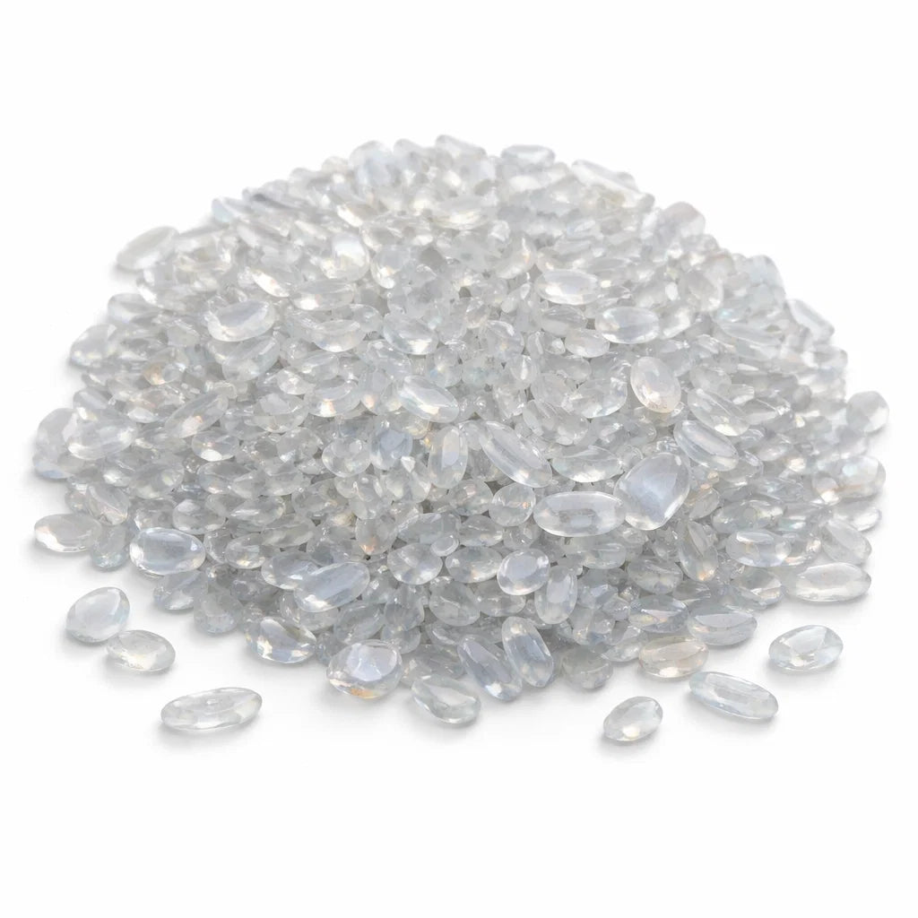 Close-up of opalite crystal chips on a clean white background showing natural colour and texture