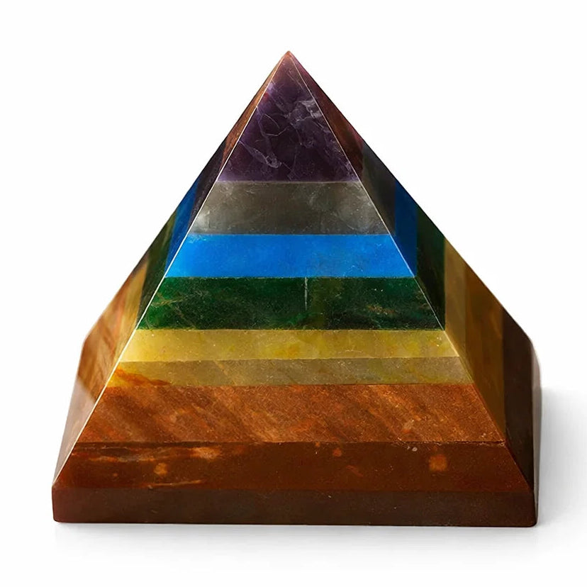 Multicolored crystal pyramid on a white background