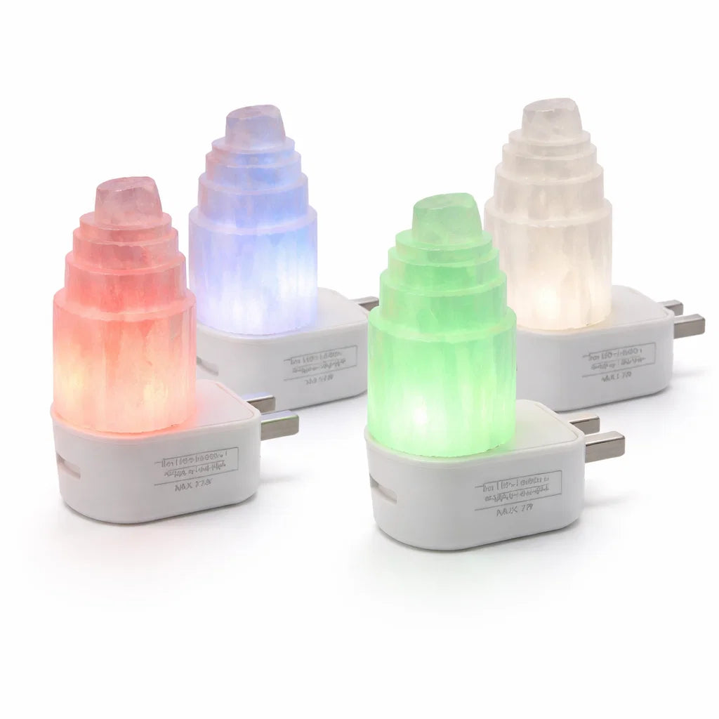 Four selenite tower lamps showing red, blue, green and white LED colour options