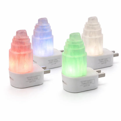 Four selenite tower lamps showing red, blue, green and white LED colour options