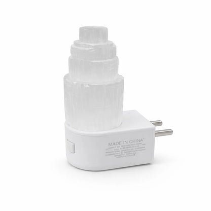 White selenite tower lamp shown on its USB base against a clean background