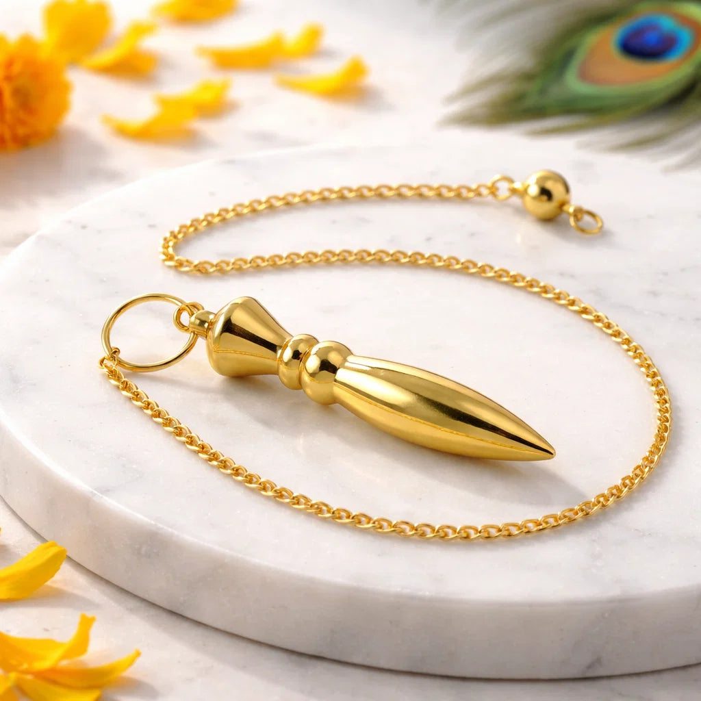 Heavy bullet pendulum displayed upright with diya and marigold petals