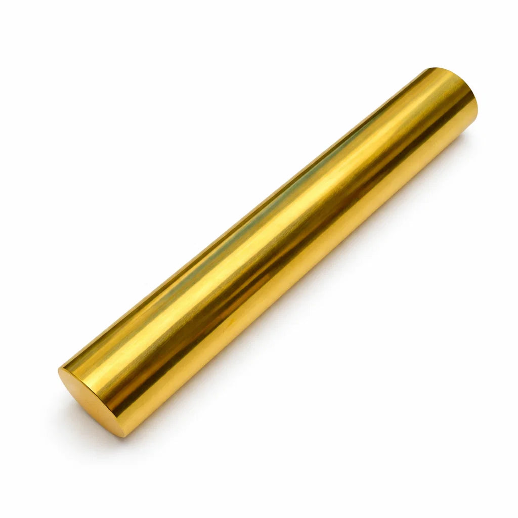 Polished brass geopathic neutralizer rod isolated on a white background