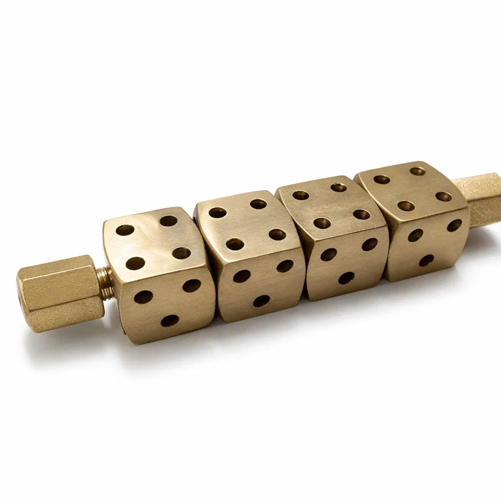 Single brass Ramal Pass dice rod isolated on a white background