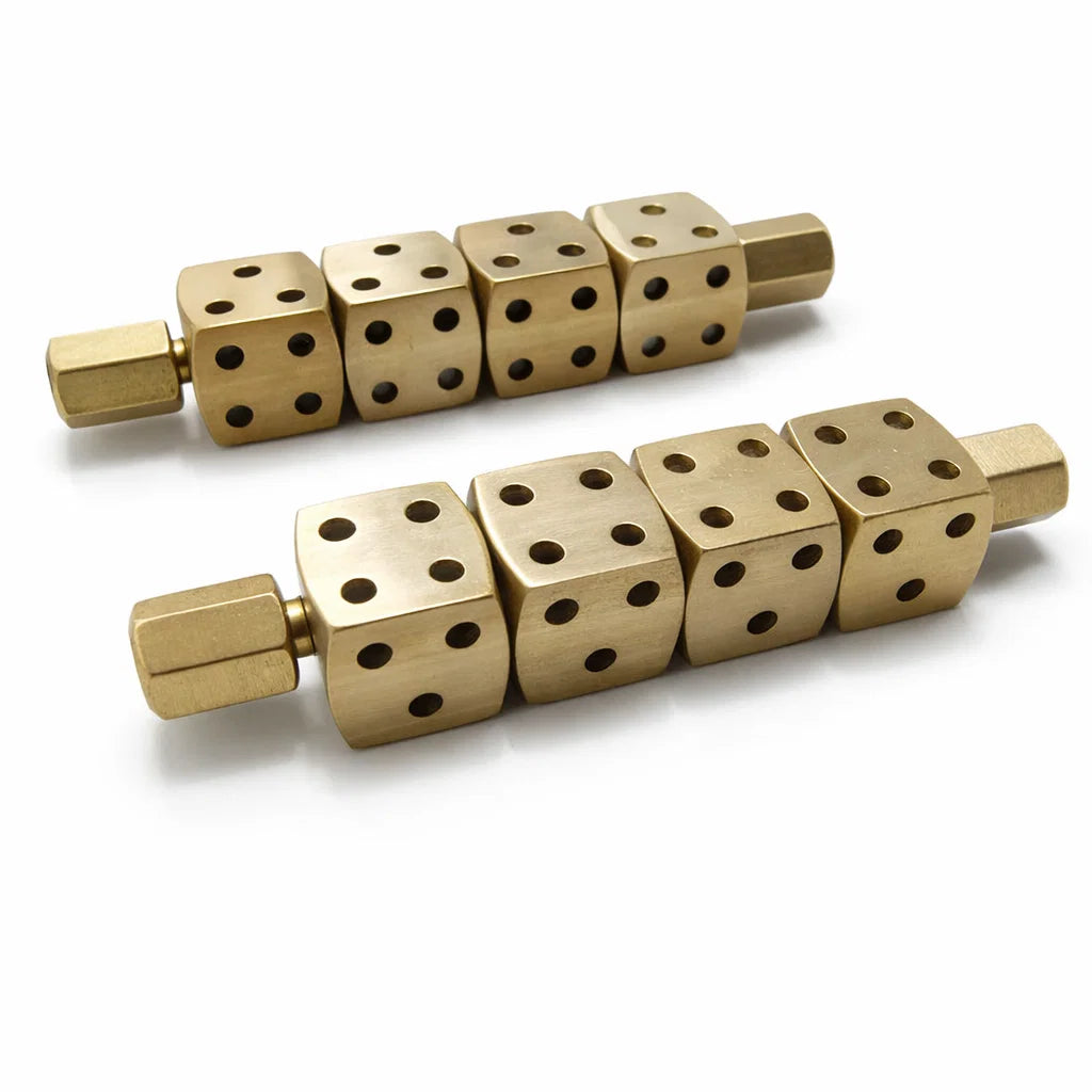 Two brass Ramal Pass rods with rotating numbered dice isolated on white