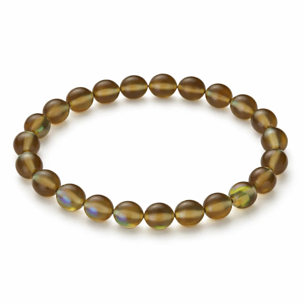 Natural brown aura quartz crystal bracelet with round beads on a clean white background