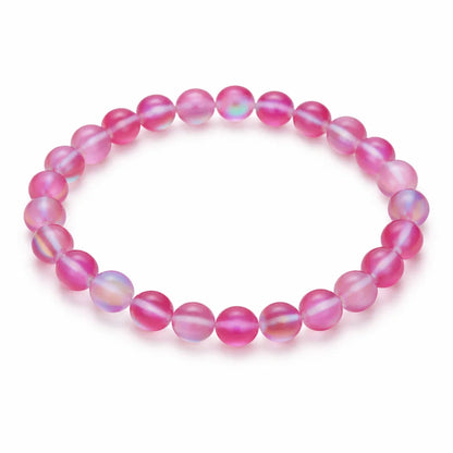 Natural light pink aura quartz crystal bracelet with round beads on a clean white background