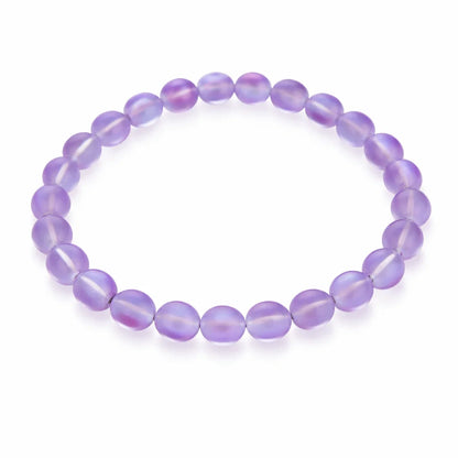 Natural purple aura quartz bead bracelet in a close white-background bead view