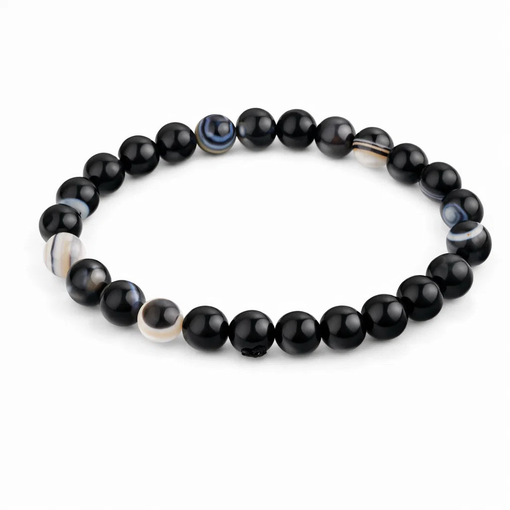 Natural black agate crystal bracelet showing the bead colour and surface on white