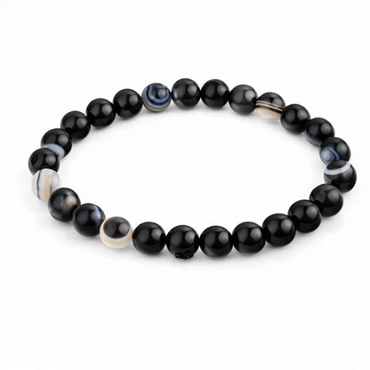 Natural black agate crystal bracelet showing the bead colour and surface on white