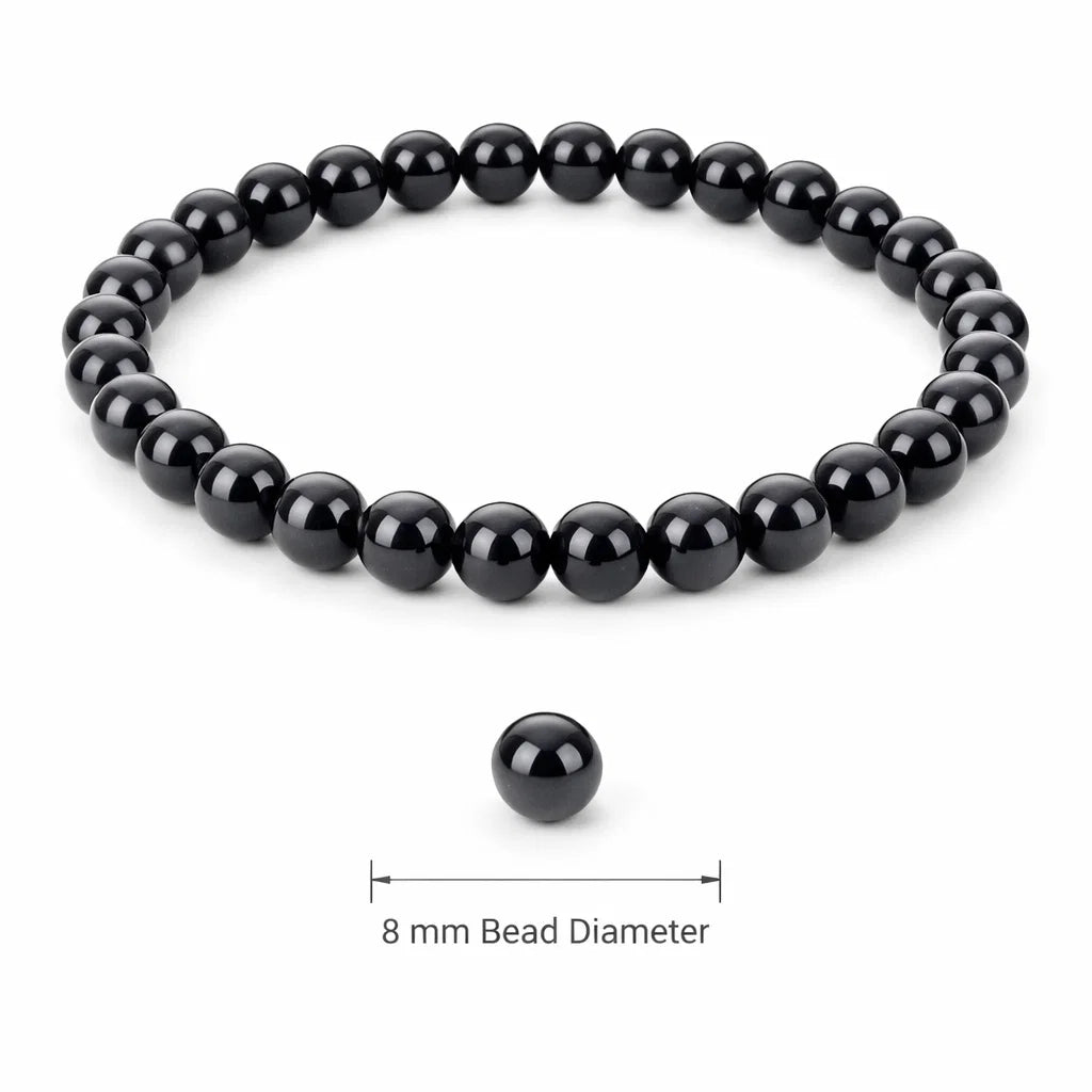 Natural black obsidian crystal bracelet with round beads on a clean white background