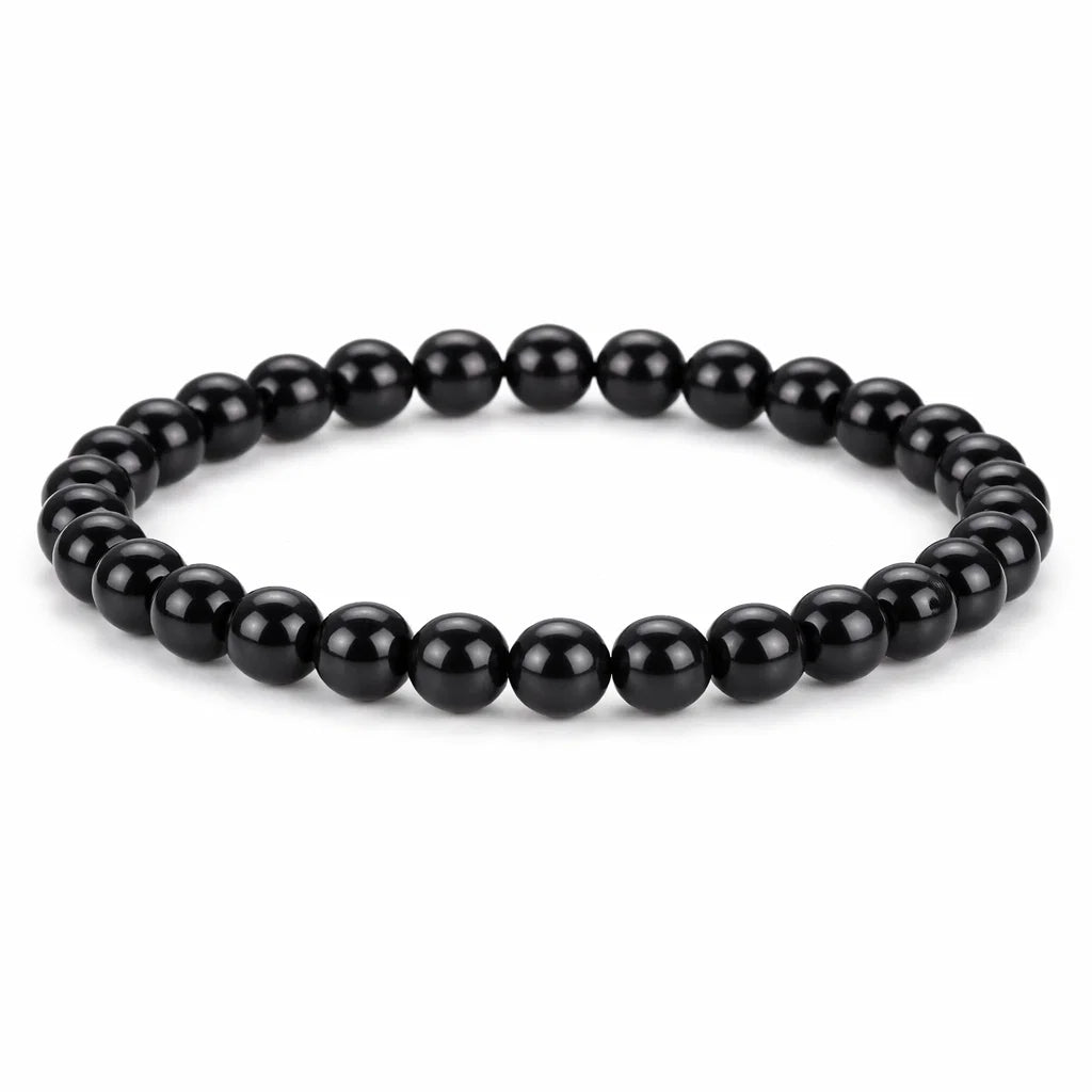 Natural black obsidian crystal bracelet centred in a clean product photograph