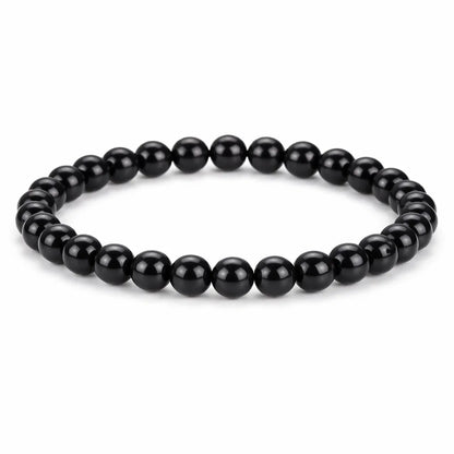 Natural black obsidian crystal bracelet centred in a clean product photograph